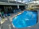 Relaxing pool view features a sun lounger and crystal clear water at 205 Golf Aire Blvd, Haines City, FL 33844