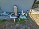 Pool equipment on the side of the house with assorted pipes and filters at 205 Golf Aire Blvd, Haines City, FL 33844