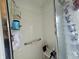 Clean, white tiled shower with bench and shower accessories at 205 Golf Aire Blvd, Haines City, FL 33844