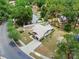 Expansive aerial view showcasing a home with a private pool, lush greenery, and ample yard space at 2271 Crystal Grove Ln, Lakeland, FL 33801