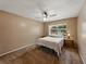 Cozy bedroom with ceiling fan, carpet, and window providing natural light at 2271 Crystal Grove Ln, Lakeland, FL 33801