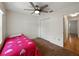 Bright bedroom featuring a ceiling fan, closet, and a large window, with light-colored walls at 2271 Crystal Grove Ln, Lakeland, FL 33801