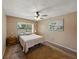 Standard bedroom with carpet, ceiling fan, and window providing natural light at 2271 Crystal Grove Ln, Lakeland, FL 33801