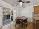 Cozy dining area with sliding glass doors to the patio and wood table and chairs at 2271 Crystal Grove Ln, Lakeland, FL 33801