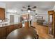 Bright kitchen view featuring wood cabinets, hardwood floors, stainless steel appliances, and a ceiling fan at 2271 Crystal Grove Ln, Lakeland, FL 33801