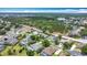 Aerial view of the community featuring the homes and mature trees at 2806 Spinning Silk Ct, Kissimmee, FL 34747