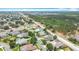 Aerial view of homes with manicured lawns nestled among trees, showcasing the community's layout at 2806 Spinning Silk Ct, Kissimmee, FL 34747