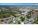 Aerial view displaying homes in a neighborhood with verdant landscaping and open space at 2806 Spinning Silk Ct, Kissimmee, FL 34747
