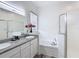 This bathroom boasts double sinks, a garden tub, and a glass enclosed walk-in shower at 2806 Spinning Silk Ct, Kissimmee, FL 34747