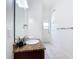 Bathroom featuring tile floors, granite vanity, framed mirror, and bright lighting at 2806 Spinning Silk Ct, Kissimmee, FL 34747