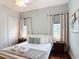 Inviting bedroom features hardwood floors, natural light, and cozy decor at 2806 Spinning Silk Ct, Kissimmee, FL 34747