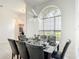 Formal dining room featuring a contemporary chandelier and a large window at 2806 Spinning Silk Ct, Kissimmee, FL 34747