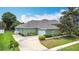 Beautiful exterior with landscaped yard and a spacious driveway at 2806 Spinning Silk Ct, Kissimmee, FL 34747