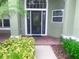 Charming front entrance with decorative door, brick walkway, and attractive landscaping providing curb appeal at 2806 Spinning Silk Ct, Kissimmee, FL 34747
