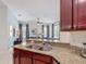 Open kitchen offering granite countertops and a view of the living room at 2806 Spinning Silk Ct, Kissimmee, FL 34747