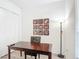 This office area features a dark wood desk, and artwork displayed above it at 2806 Spinning Silk Ct, Kissimmee, FL 34747