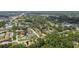Aerial view of a neighborhood with lush greenery, serene lakes, and well-maintained streets, creating a tranquil environment at 519 Market W Sq, Lakeland, FL 33813