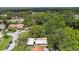 Aerial view of a house nestled among lush trees, offering privacy and a serene setting at 519 Market W Sq, Lakeland, FL 33813