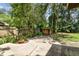 Backyard featuring a wooden shed and lush landscaping at 519 Market W Sq, Lakeland, FL 33813