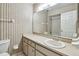 A bathroom with vanity and mirror and a tub shower combo exudes a functional design at 519 Market W Sq, Lakeland, FL 33813