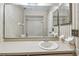 Neutral bathroom featuring a vanity and a tub with white tile and wallpaper at 519 Market W Sq, Lakeland, FL 33813