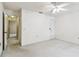 This bedroom with a ceiling fan and neutral carpet offers versatility and a calming atmosphere at 519 Market W Sq, Lakeland, FL 33813