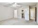 Bright bedroom featuring carpet, ceiling fan, and a closet at 519 Market W Sq, Lakeland, FL 33813