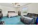 Bright bedroom with a ceiling fan and recliner at 519 Market W Sq, Lakeland, FL 33813