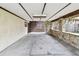 A large covered carport featuring stone accents and space for parking vehicles at 519 Market W Sq, Lakeland, FL 33813