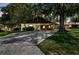 Charming single-Gathering home with mature trees, inviting entrance, and a spacious driveway at 519 Market W Sq, Lakeland, FL 33813