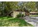 View of the side of the home and its lovely green grass at 519 Market W Sq, Lakeland, FL 33813