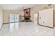Spacious living room with tiled flooring, fireplace, and french doors to the exterior at 519 Market W Sq, Lakeland, FL 33813