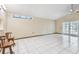 Open living area with tiled floors and french doors; a versatile space for dining and entertaining at 519 Market W Sq, Lakeland, FL 33813