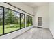 Sunroom featuring neutral tile flooring and great backyard views at 519 Market W Sq, Lakeland, FL 33813