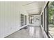 Sunroom with tile floors, French doors, and views of the backyard at 519 Market W Sq, Lakeland, FL 33813