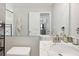 Bright bathroom features a marble countertop and sink, along with a decorative mirror and updated faucet at 811 Patricia Pl, Lakeland, FL 33809