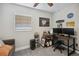 Room with a couch, desk, computer, and decorations including Ford and Personal Cave signs with a ceiling fan at 811 Patricia Pl, Lakeland, FL 33809