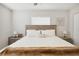 Inviting bedroom with neutral tones, wood accents, and ample natural light through the windows at 811 Patricia Pl, Lakeland, FL 33809