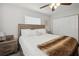 Comfortable bedroom featuring a wood-framed bed, soft lighting, and a neutral color scheme at 811 Patricia Pl, Lakeland, FL 33809