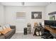 Office area with couch, desk, computer, and decorations in a room with a ceiling fan and window at 811 Patricia Pl, Lakeland, FL 33809