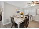 Spacious dining area with a large white table, wood chairs, and modern décor at 811 Patricia Pl, Lakeland, FL 33809