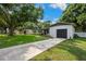 Attractive single-story home with a long driveway leading to an attached garage at 811 Patricia Pl, Lakeland, FL 33809