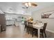 Open-concept kitchen with white cabinets, granite countertops, and stainless steel appliances at 811 Patricia Pl, Lakeland, FL 33809