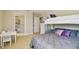Bedroom featuring a bunkbed, dresser, desk and walk-in closet at 1140 Terralago Way, Kissimmee, FL 34746