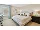 Cozy bedroom with neutral tones, decorative mirrors, and a comfortable-looking bed at 1140 Terralago Way, Kissimmee, FL 34746