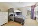 Charming bedroom with a bunk bed, complemented by a dresser for ample storage at 1140 Terralago Way, Kissimmee, FL 34746