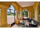 Inviting screened-in patio with comfortable seating and views of the neighborhood at 1140 Terralago Way, Kissimmee, FL 34746