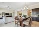 Open-concept dining area seamlessly connects to a comfortable living space, perfect for entertaining at 1140 Terralago Way, Kissimmee, FL 34746