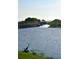 Lake view of private boat dock offers a serene escape and recreational opportunities in this waterside community at 1140 Terralago Way, Kissimmee, FL 34746