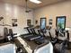 Well-equipped gym featuring treadmills, elliptical machines, and weight-training equipment at 1140 Terralago Way, Kissimmee, FL 34746